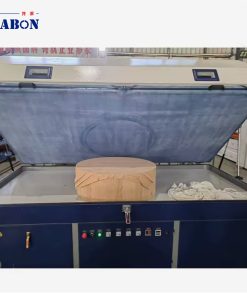 Curved veneer workpiece placed on the PV-2500A vacuum membrane press table